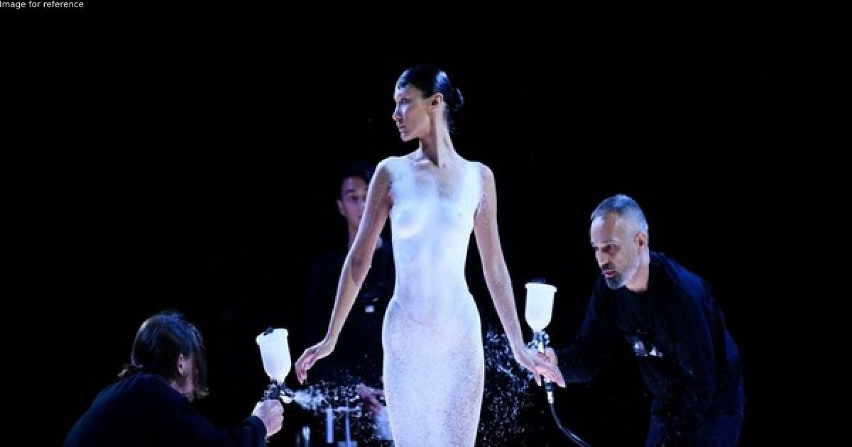 Watch: Bella Hadid gets dress spray-painted on her body at the Coperni show in Paris
